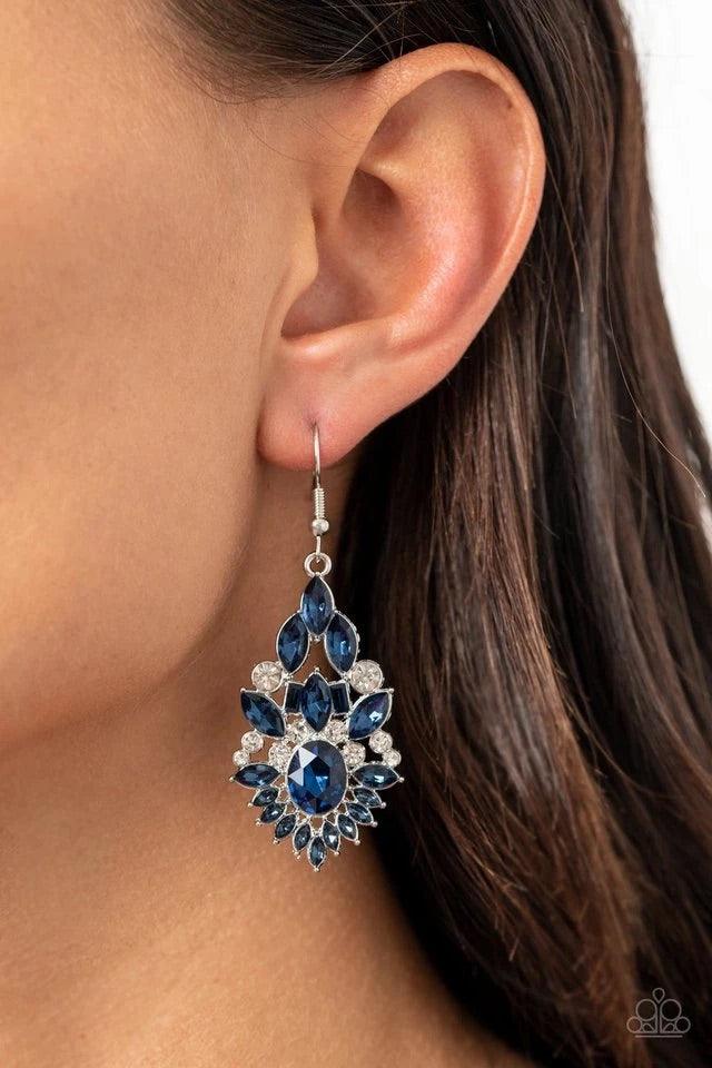 Paparazzi Accessories Ice Castle Couture - Blue Featuring an elegant variety of round, marquise, oval, and emerald style cuts, a glittery collision of blue and white rhinestones delicately coalesce into a jaw-dropping lure. Earring attaches to a standard
