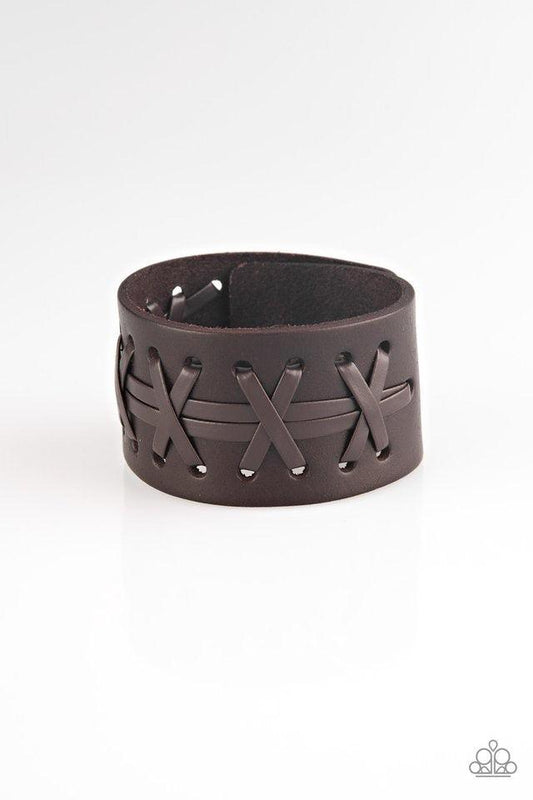 Paparazzi Accessories Super Sporty - Brown Brown leather cording is laced across the front of a thick leather band for a rugged look. Features an adjustable snap closure. Sold as one individual bracelet. Jewelry