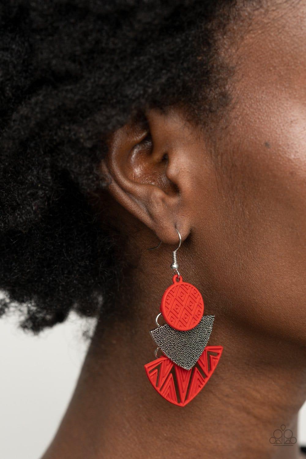 Paparazzi Accessories Jurassic Juxtaposition - Red Painted in a fiery red matte, textured frames flank a studded silver frame, connecting into a colorful tribal inspired lure. Earring attaches to a standard fishhook fitting. Jewelry