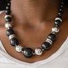 Paparazzi Accessories New York Nightlife - Black Gradually increasing in size toward the center, dramatic black beads and shiny silver beads drape below the collar for a refined look. Glistening silver accents are sprinkled between the classic beads, addi