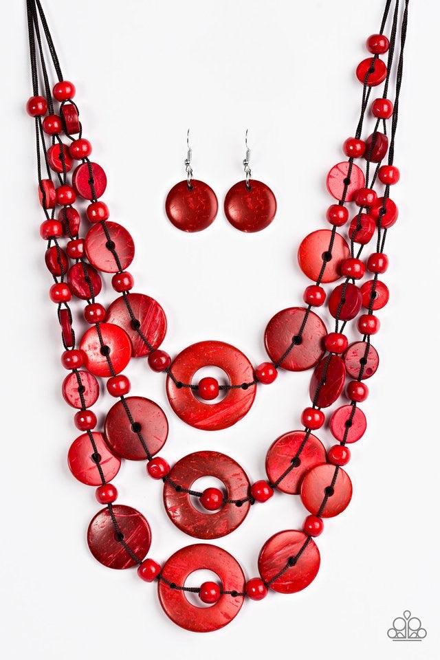 Paparazzi Accessories Bali Boardwalk - Red Brushed in a distressed finish, vivacious red wooden beads and discs trickle along three strands, creating a summery look down the chest. Features a button loop closure. Jewelry