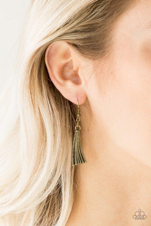 Paparazzi Accessories Primal Princess - Brass Embossed in zigzagging patterns, brass crescents swing from two ornate brass plates for a tribal inspired look. Dotted with studded textures, the antiqued pendants delicately stack below the collar for a bold
