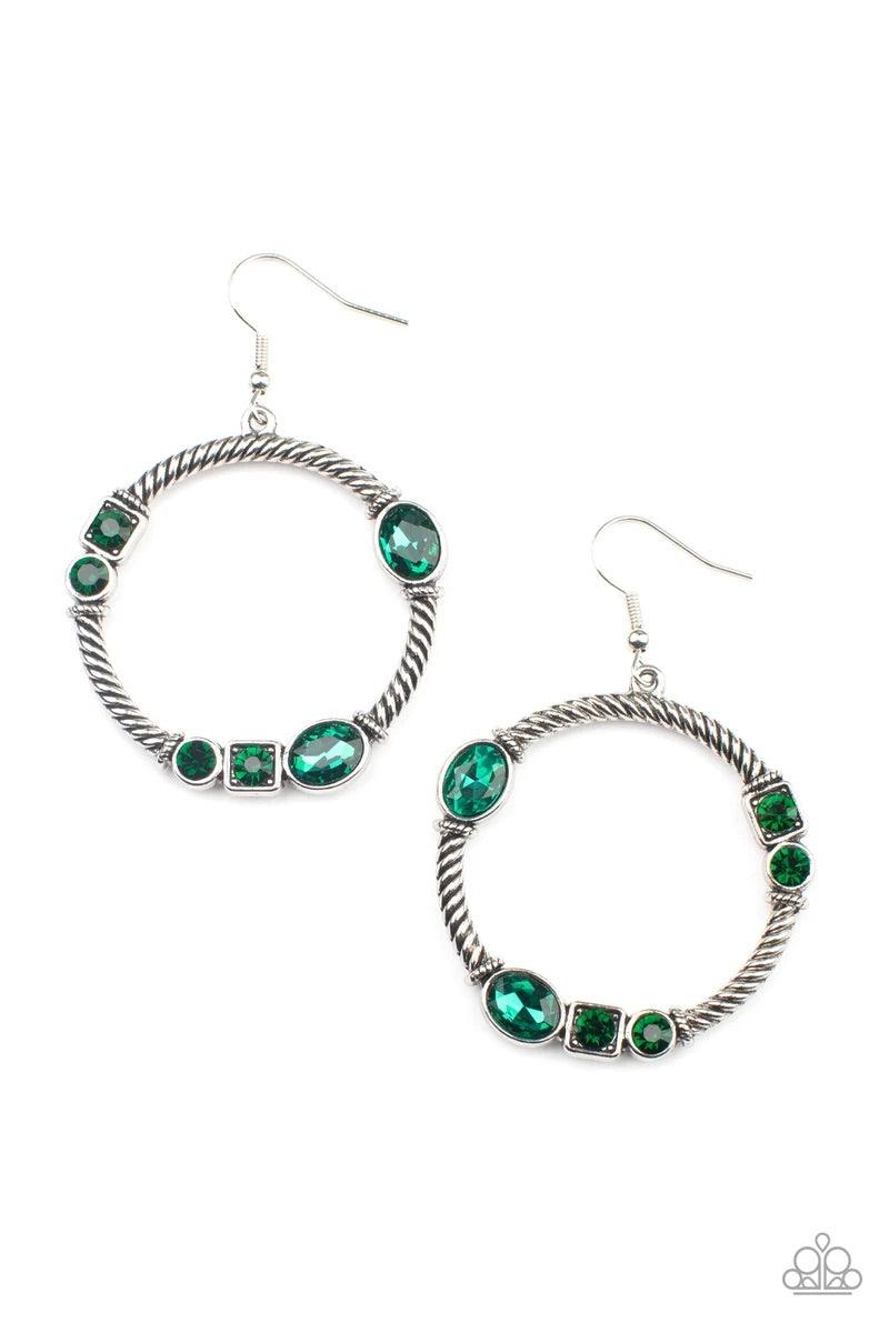 Paparazzi Accessories Glamorous Garland - Green Featuring round, oval, and square cuts, a collection of glittery green rhinestones haphazardly adorn the front of a textured silver hoop, for a gritty-glamorous look. Earring attaches to standard fishhook fi