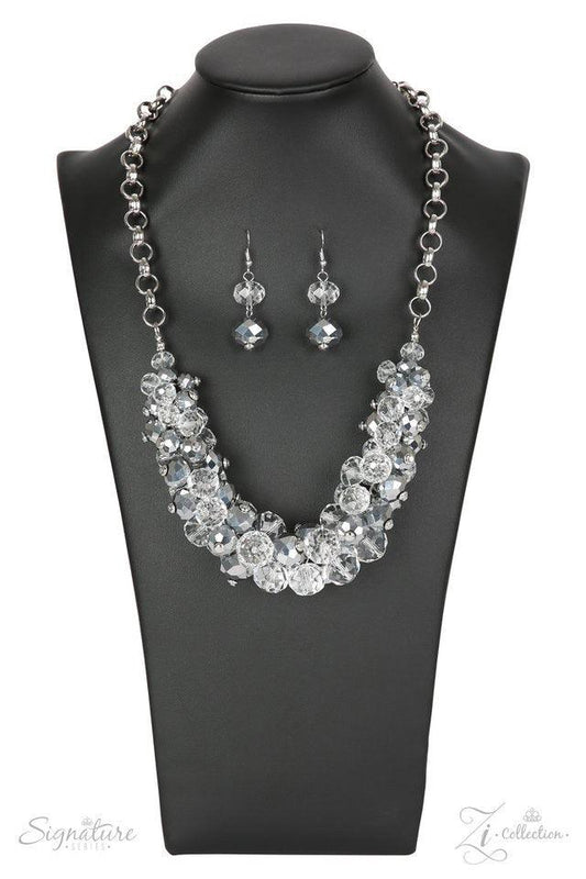 Paparazzi Accessories The Erika 💗ZiCollection $25💗 Sparkling crystal-like beading boldly collides with metallic beads featuring light-catching faceted edges to create a gorgeous pendant that falls just below the collar. The beads gradually increase in s