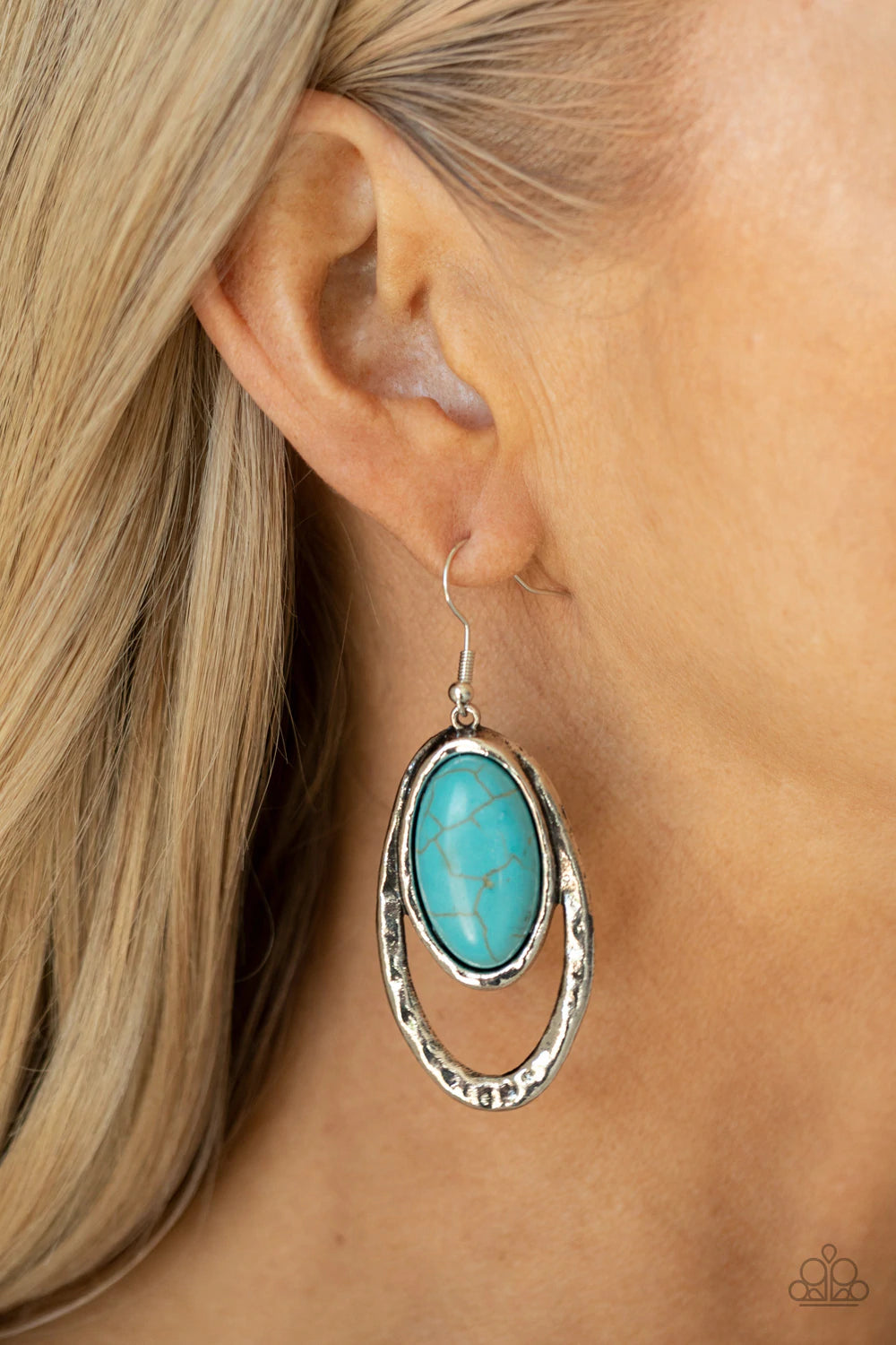 Paparazzi Accessories Pasture Paradise- Blue An oval turquoise stone is pressed into a hammered silver fitting that attaches to the top of a hammered silver oval frame, creating a rustic lure. Earring attaches to a standard fishhook fitting. Sold as one p