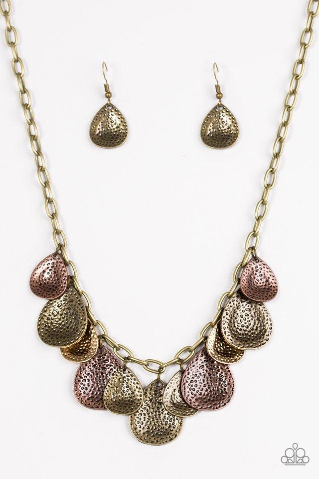 Paparazzi Accessories Storm Goddess - Brass Delicately hammered in light-catching shimmer, brass, copper, and silver teardrops drip from the bottom of a glistening brass chain, creating a bold fringe below the collar. Features an adjustable clasp closure.