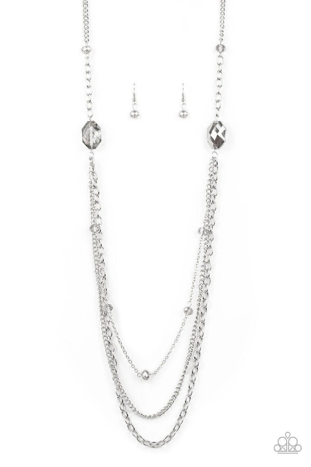 Paparazzi Accessories Dare To Dazzle - Silver Infused with metallic crystal-like beads, a pair of glittery metallic gems gives way to layers of mismatched silver chains for a dazzling look. Features an adjustable clasp closure. Sold as one individual neck