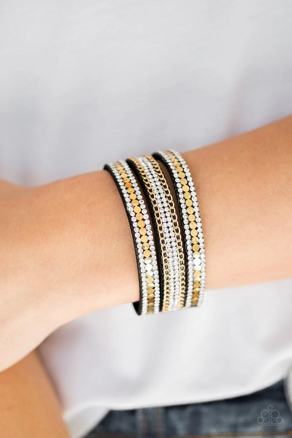 Paparazzi Accessories Fashion Fanatic - Gold Rows of flat gold discs, glassy white rhinestones, and shimmery gold chains are encrusted along black suede bands for a sassy look. Features an adjustable snap closure. Sold as one individual bracelet. Jewelry