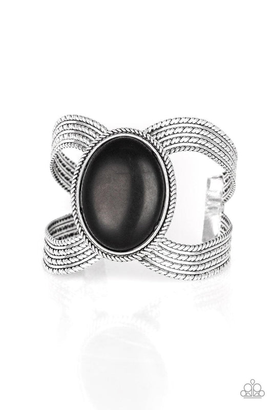 Paparazzi Accessories Coyote Couture - Black A dramatic black stone pendant is pressed into the center of textured silver bars, creating a bold seasonal cuff. Sold as one individual bracelet. Jewelry