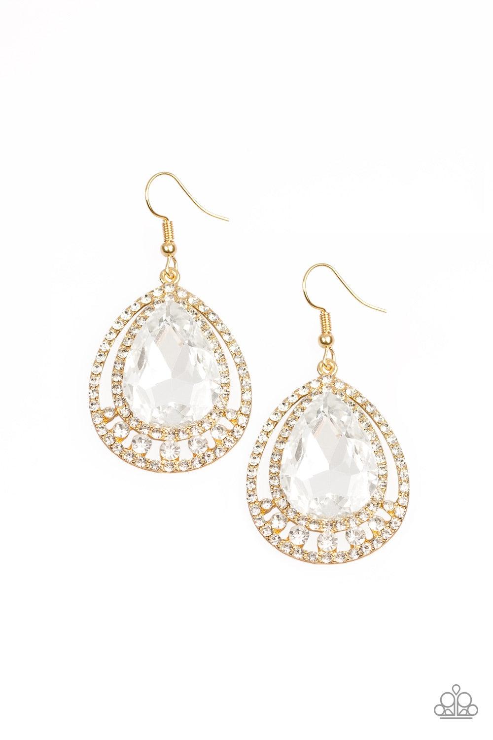 Paparazzi Accessories All Rise For Her Majesty - Gold A dramatically oversized white teardrop gem is nestled inside doubled gold frames radiating with glassy white rhinestones for a jaw-dropping style. Earring attaches to a standard fishhook fitting. Jewe