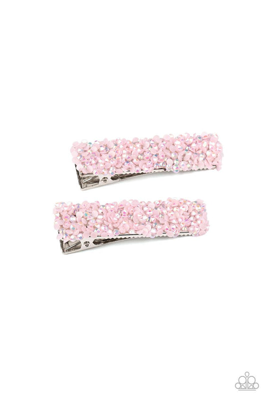 Paparazzi Accessories HAIR Comes Trouble - Pink Featuring a milky iridescence, dainty pink rhinestones are sprinkled across two rectangular silver frames, creating a flirtatious pair of hair clips. Features a standard hair clip on the back. Sold as one pa