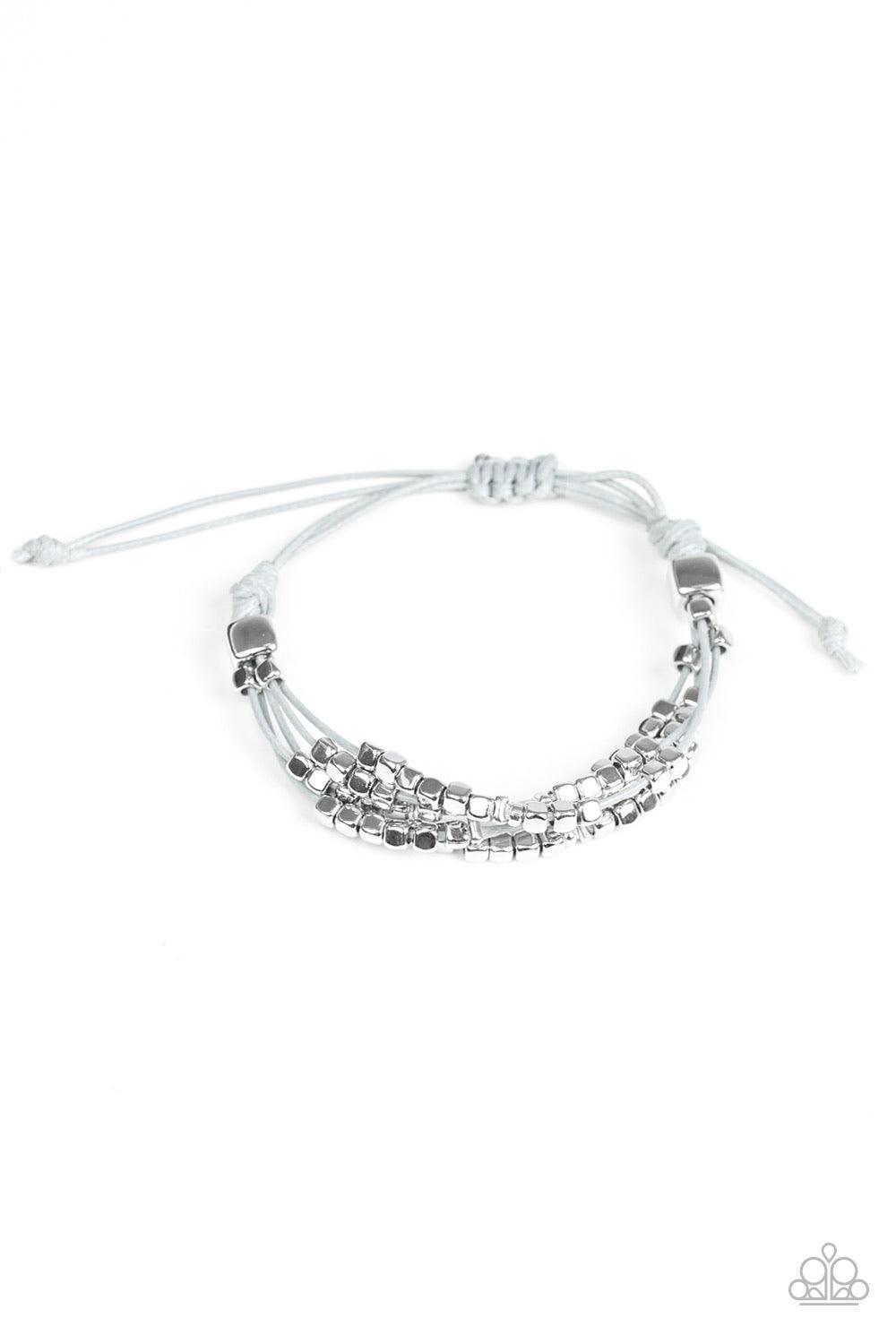 Paparazzi Accessories Modern Minimalism - Silver A collection of dainty silver beads and glistening silver cubes are threaded along strands of shiny gray cording around the wrist for a minimalist inspired look. Features an adjustable sliding knot clos Jew