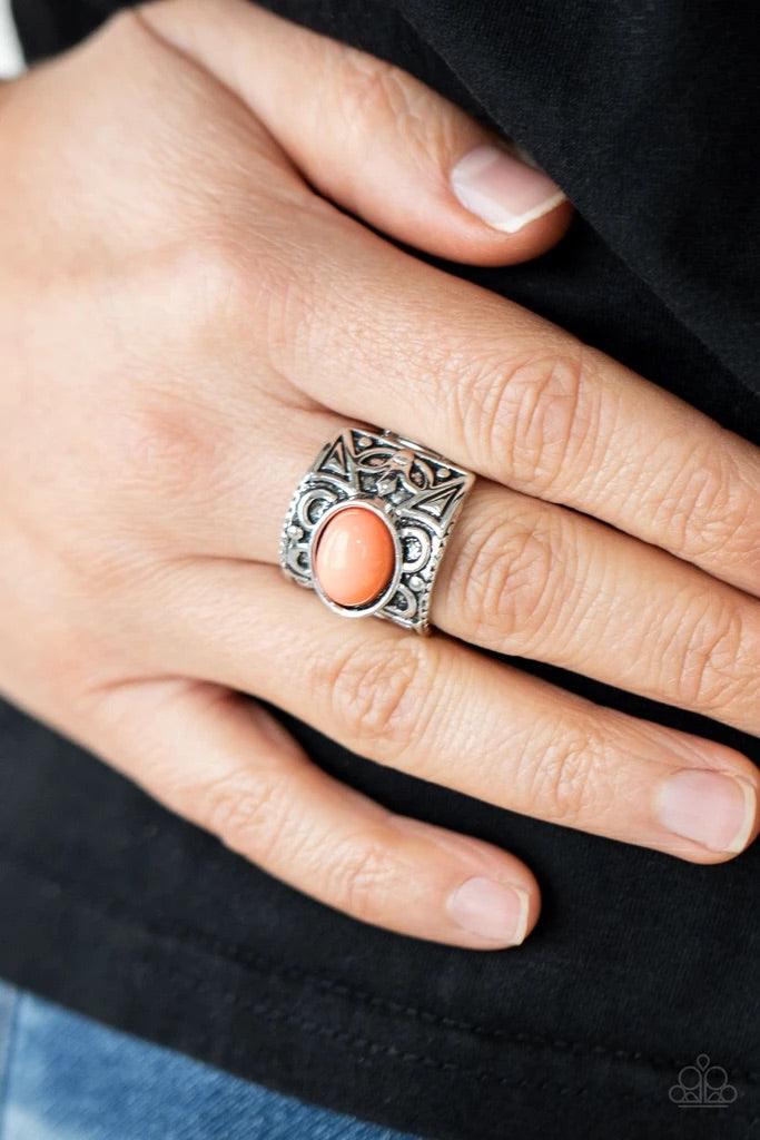 Paparazzi Accessories Bubbly Bonanza - Orange A bubbly Burnt Coral bead is pressed into the center of a thick silver frame embossed in a leafy geometric pattern, creating a colorfully whimsical centerpiece. Features a stretchy band for a flexible fit. Jew