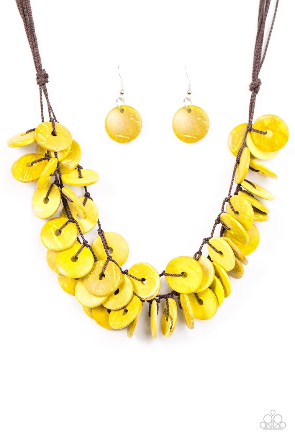 Paparazzi Accessories Jammin In Jamaica - Yellow Shiny wooden discs brushed in a yellow finish trickle along shiny black cording, creating clustered layers below the collar. Features a button-loop closure. Jewelry