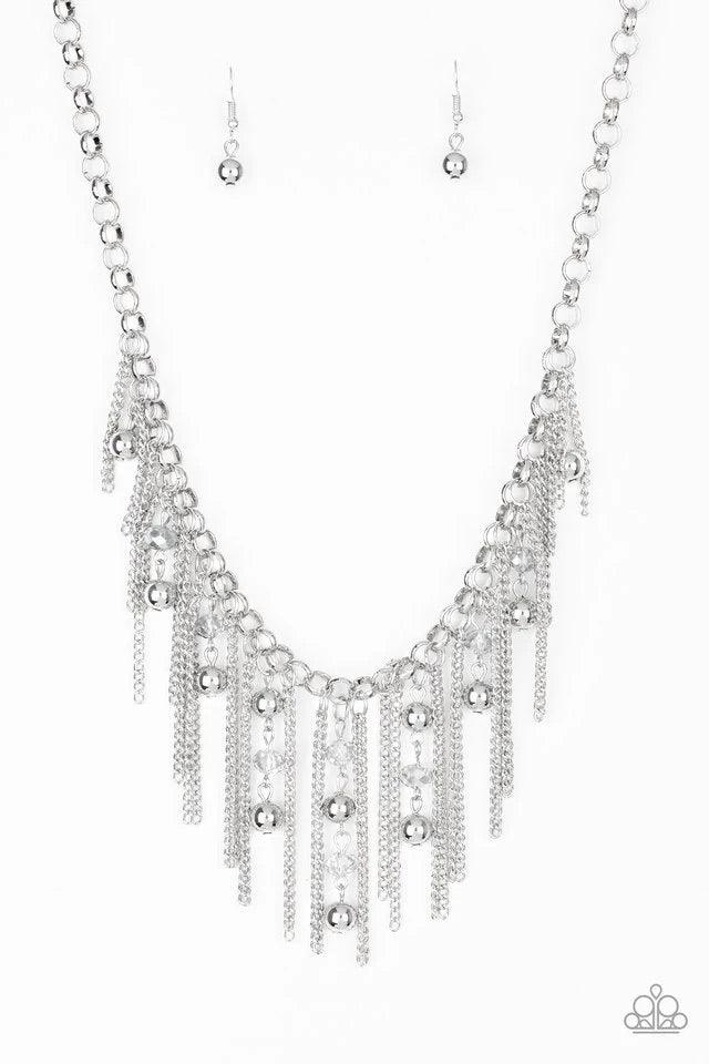 Paparazzi Accessories Ever Rebellious - Silver Glistening silver chains and strands of metallic crystal-like beads and glistening silver beads stream from the bottom of a bold silver chain, creating a sassy fringe below the collar. Features an adjustable