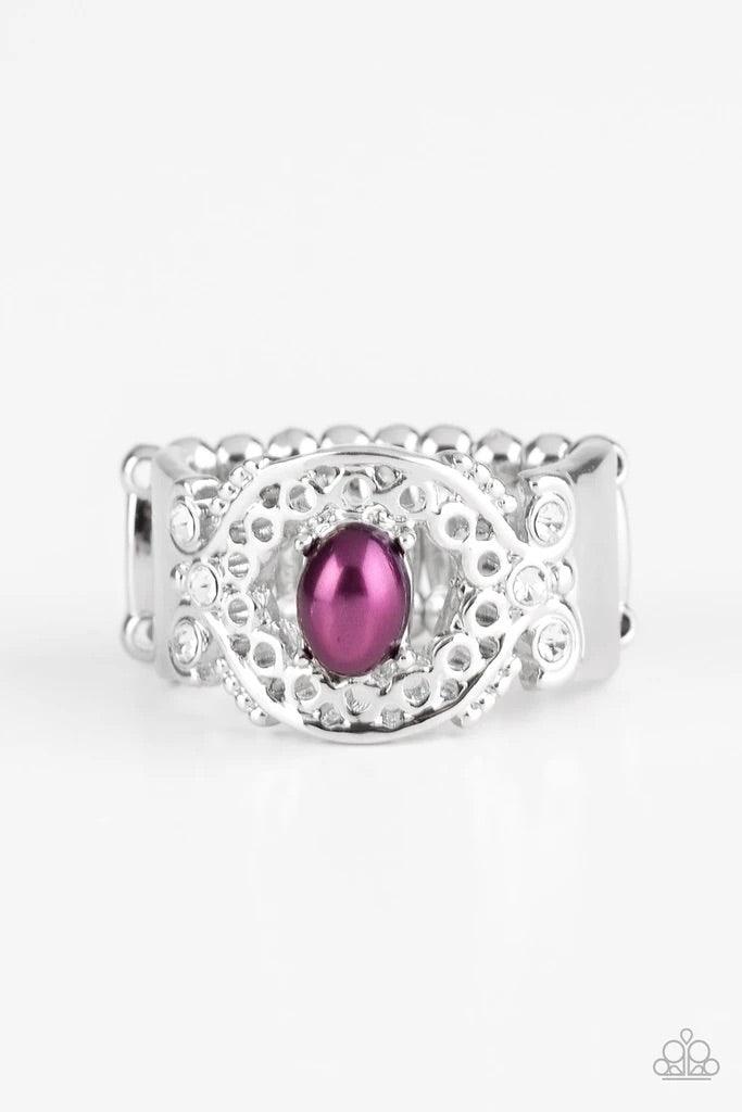 Paparazzi Accessories Mod Modest - Purple Dotted with glittery white rhinestones, an airy filigreed silver band arcs across the finger in a regal fashion. A pearly purple bead is pressed into the center of the band for a timeless finish. Features a stretc