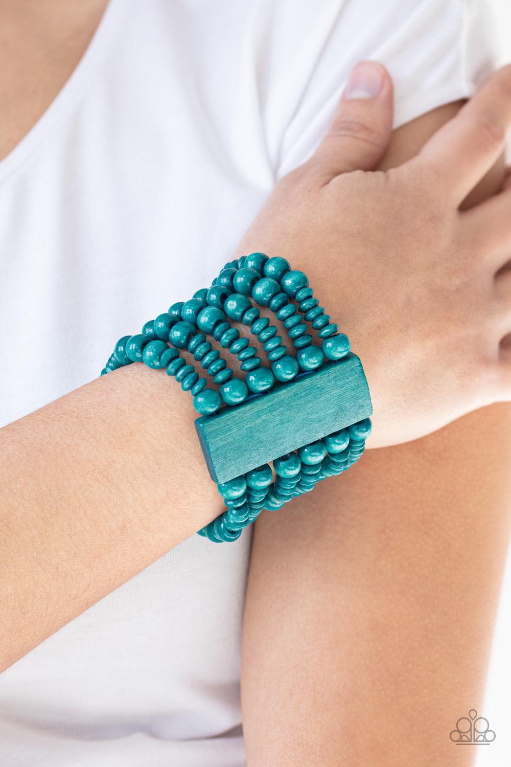 Paparazzi Accessories Don’t Stop BELIZE-ing - Blue Brushed in a refreshing blue finish, rectangular wooden frames hold together a collection of wooden beads threaded along stretchy bands, coalescing into a summery display around the wrist. Jewelry