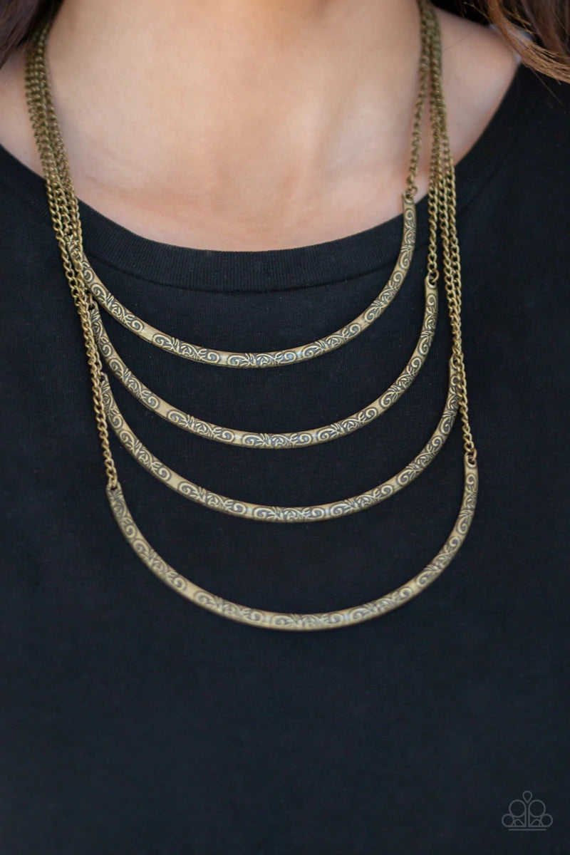 Paparazzi Accessories It Will Be Over MOON - Brass Embossed in ornate patterns, brass crescent frames layer down the chest for a statement-making look. Features an adjustable clasp closure. Sold as one individual necklace. Includes one pair of matching ea