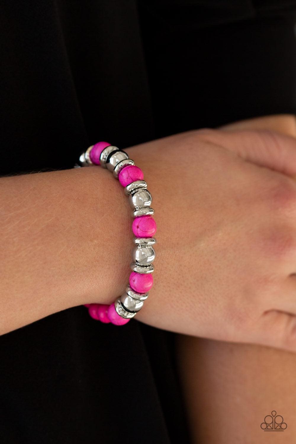 Paparazzi Accessories Across The Mesa - Pink A collection of silver accents and vivacious pink stones are threaded along a stretchy band for a seasonal look. Jewelry