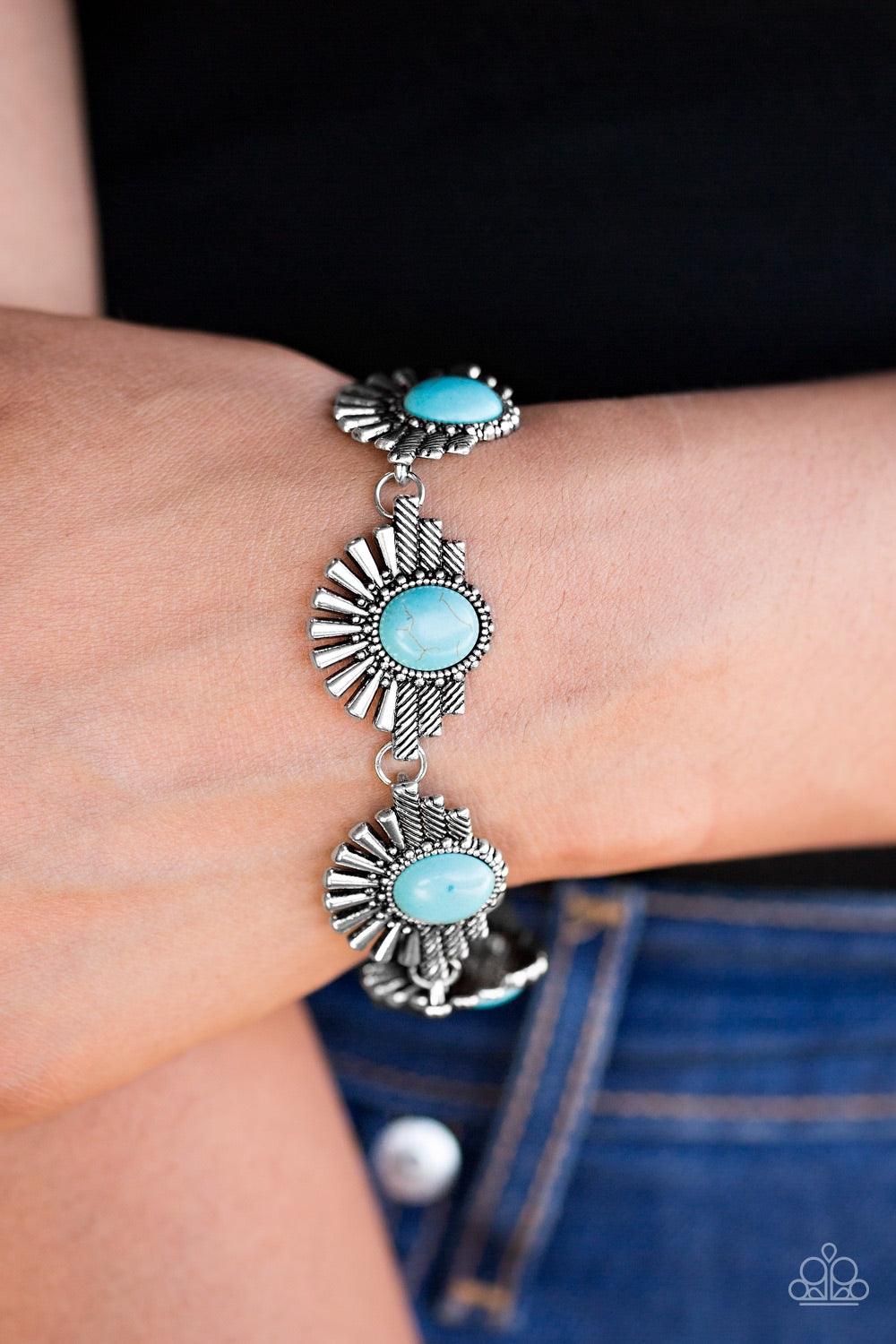 Paparazzi Accessories Desert Marvel - Blue Earthy turquoise beads are pressed into the centers of flared silver frames for a handcrafted look. The tribal inspired frames link across the wrist in a simply seasonal fashion. Features an adjustable clasp clos