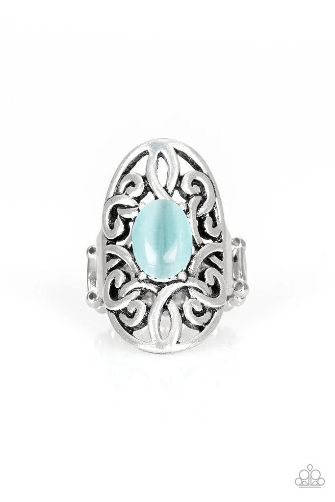 Paparazzi Accessories Gleam Big - Blue A glowing blue cat's eye stone is pressed into the center of an oval backdrop swirling with vine-like filigree for a whimsical look. Features a stretchy band for a flexible fit. Sold as one individual ring. Jewelry