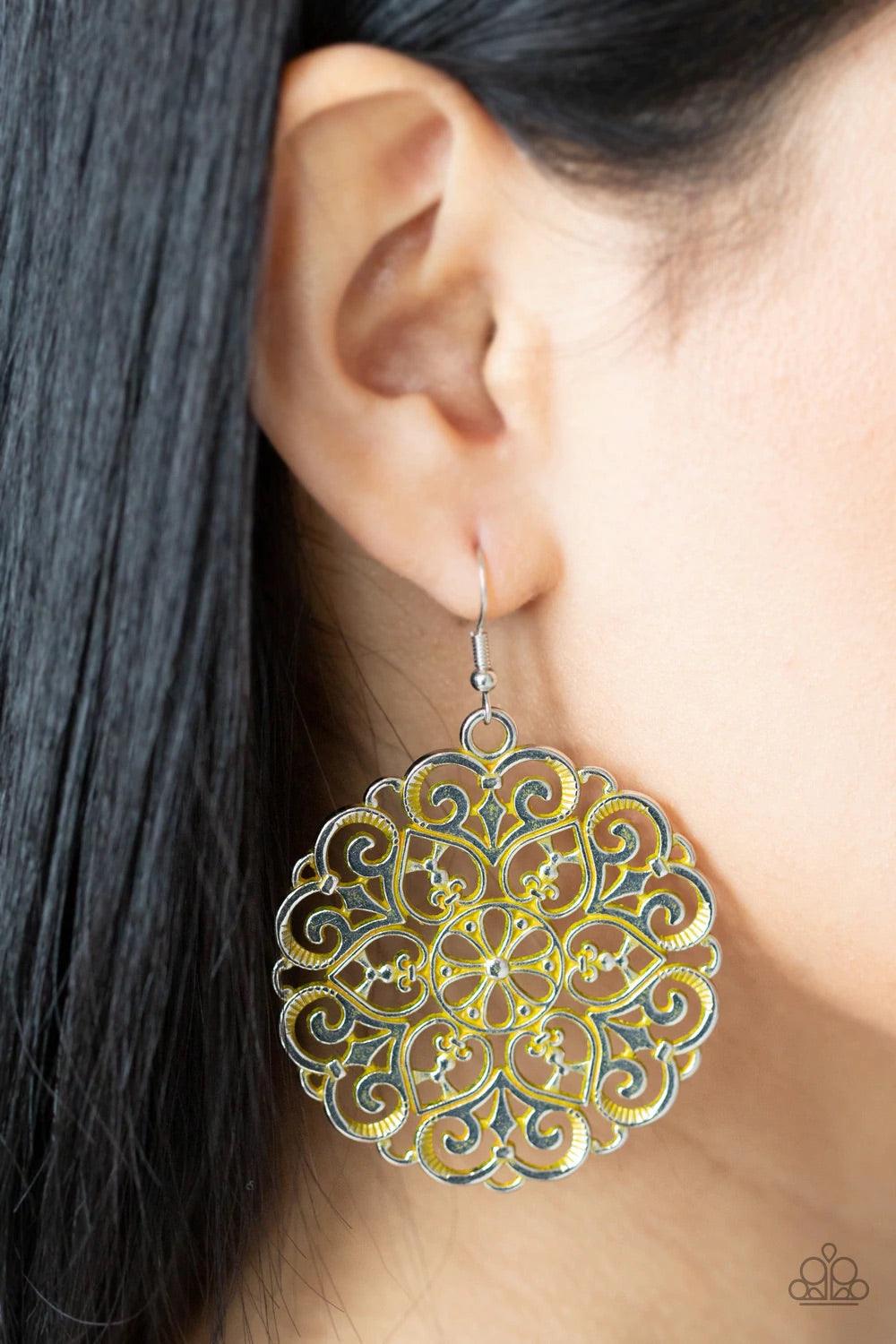 Paparazzi Accessories Mandala Effect - Yellow Brushed in a rustic yellow finish, an oversized mandala-like silver frame swings from the ear for a seasonal pop of color. Earring attaches to a standard fishhook fitting. Sold as one pair of earrings. Jewelry