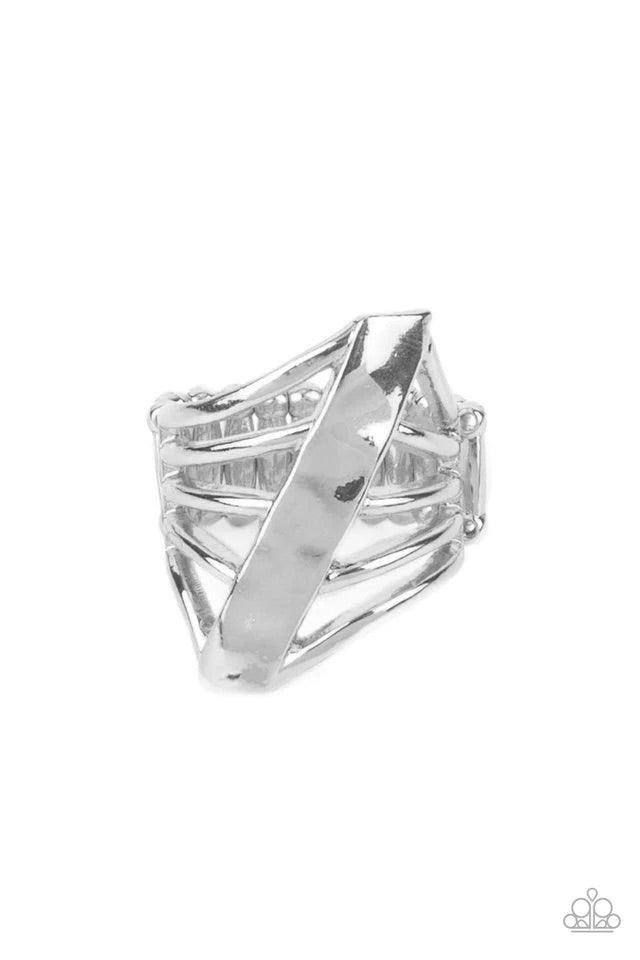 Paparazzi Accessories Encrypted Edge - Silver A daring hammered silver column slants across the finger intersecting an airy layered band resulting in a dramatically edgy vibe. Features a stretchy band for a flexible fit. Rings