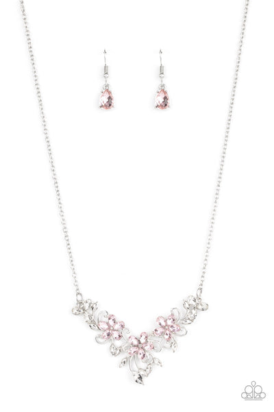 Paparazzi Accessories Floral Fashion Show - Pink A twinkly trio of pink rhinestone petaled flowers bloom atop a leafy silver backdrop adorned in marquise cut white rhinestones, resulting in a timeless floral centerpiece below the collar. Features an adjus