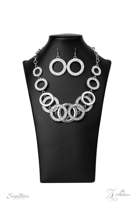 Paparazzi Accessories The Keila 💗💗ZiCollection $25💗💗 Varying in size and shimmer, shiny silver rings and white rhinestone encrusted hoops sporadically link into two bubbly rows below the collar. The flawless frames increase in size at the center for d