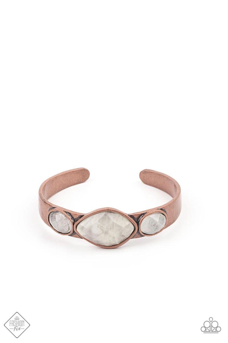 Paparazzi Accessories Next Stop, Olympus! - Copper Featuring faceted surfaces, an asymmetrical collection of cloudy faux stone beads are pressed along the spine of a rustic copper cuff, creating a mystical accent piece that wraps around the wrist. Sold as