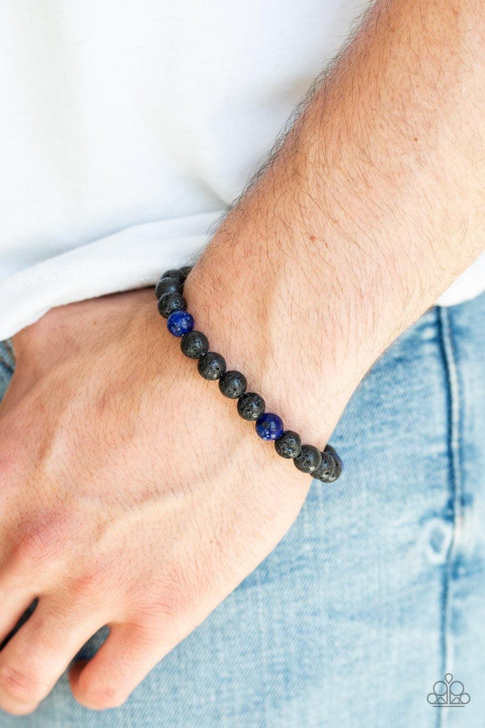 Paparazzi Accessories Enlivened - Blue An earthy collection of black lava stones and glassy blue stones are threaded along a stretchy band around the wrist for a seasonal look. Jewelry