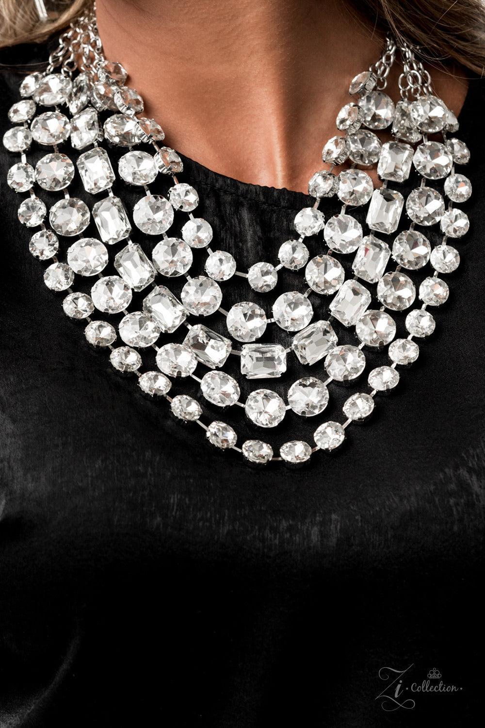Paparazzi Accessories Irresistible 💗💗ZiCollection $25💗💗 Featuring round and emerald style cuts, row after row of dramatically oversized white rhinestones delicately link into blinding layers below the collar. Featuring sleek silver fittings, each rhin