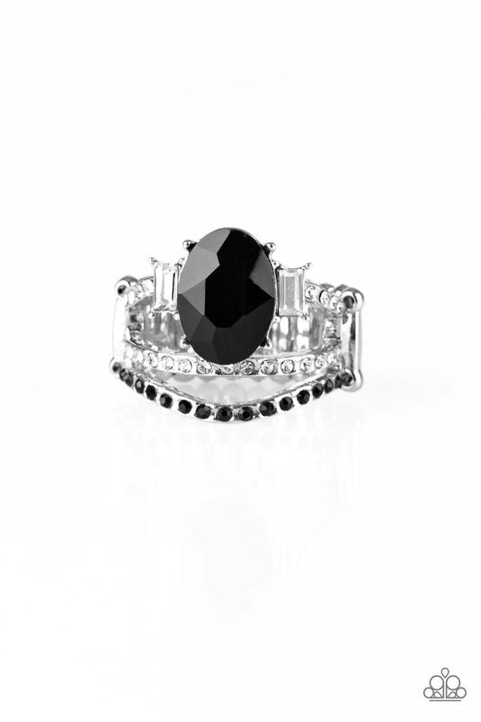 Paparazzi Accessories Spectacular Sparkle - Black Paparazzi Accessories $5 Jewelry. Encrusted with glittery black and glassy white rhinestones, three shimmery silver bands arc across the finger. The uppermost band is crowned with a dramatic black rhinesto