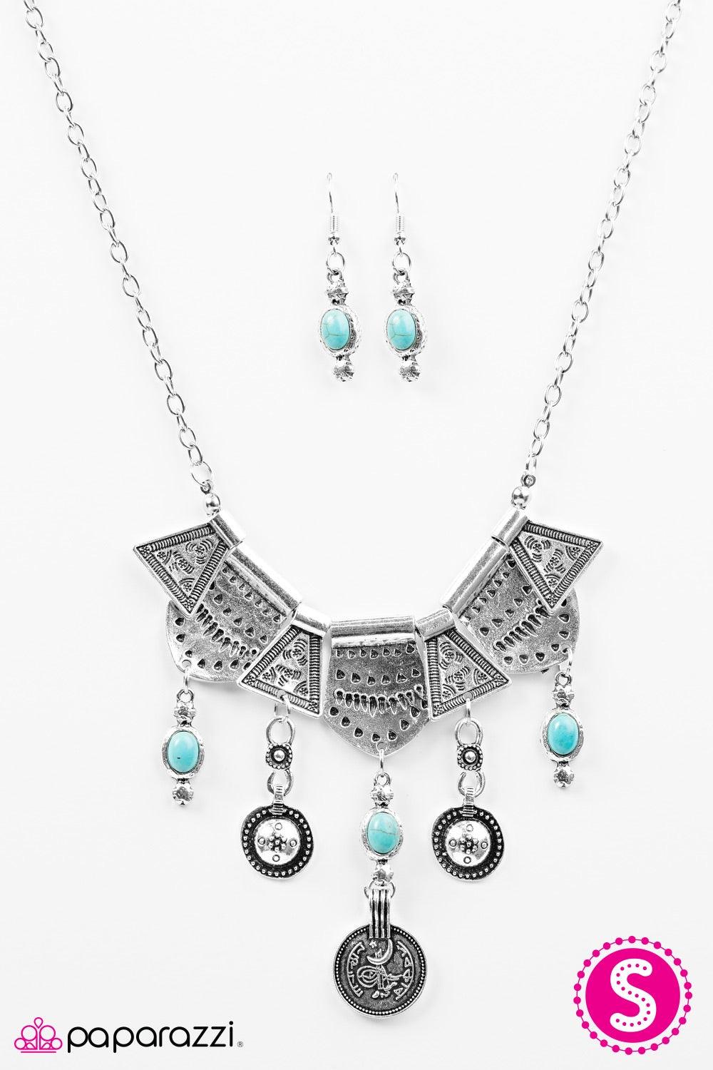 Paparazzi Accessories Paradise Princess - Blue Delicately hammered and etched with tribal patterns, shiny silver plates fan out below the collar in an indigenous fashion. Brushed in an antiqued shimmer, turquoise stone accents swing from the bottom of the