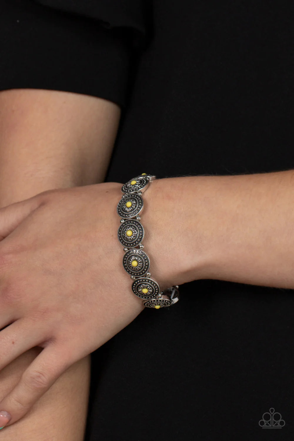 Paparazzi Accessories Granada Garden Party - Yellow Dotted with faceted Illuminating beaded centers, a studded collection of floral silver frames alternate with dainty silver beads along stretchy bands around the wrist for a whimsical pop of color. Sold a