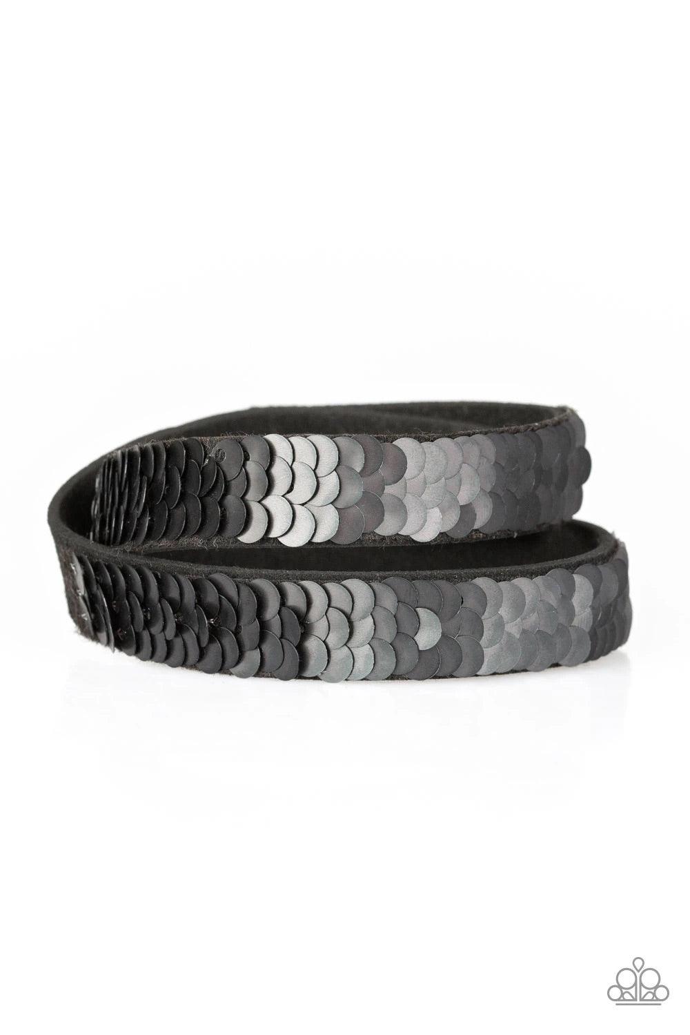 Paparazzi Accessories Under the Sequins - Black Row after row of shimmery sequins are stitched across the front of a lengthened black suede band. The elongated band allows for a trendy double wrap design. Bracelet features reversible sequins that change f