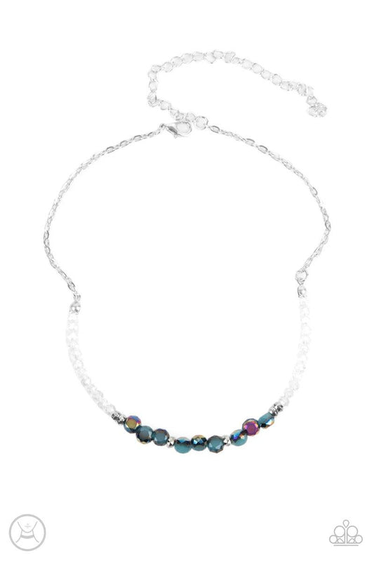 Paparazzi Accessories Space Odyssey ~Multi A dainty collection of mismatched oil spill beads ad iridescent crystal-like accents are threaded along an invisible wire around the neck for a stellar look. Features an adjustable clasp closure. Sold as one indi