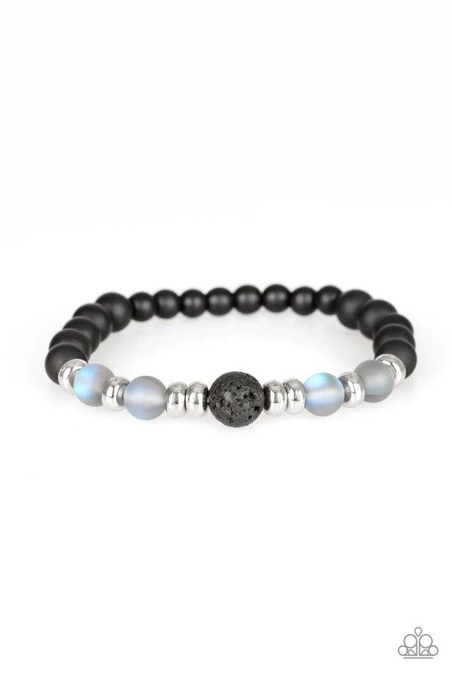 Paparazzi Accessories Grace - Blue Infused with dainty silver beads, a collection of black stone beads, black lava rock beads, and glassy iridescent beads are threaded along a stretchy band around the wrist for a seasonal flair. Sold as one individual bra
