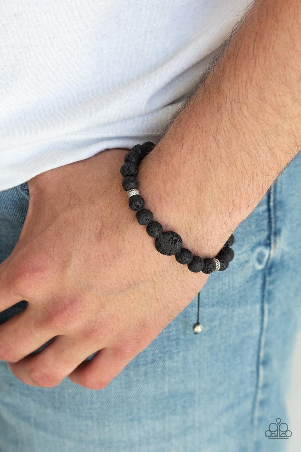 Paparazzi Accessories Intention - Black Infused with dainty silver beads, a collection of earthy black lava rock beads are threaded along a shiny cord around the wrist for a seasonal look. Features an adjustable sliding knot closure. Sold as one individua