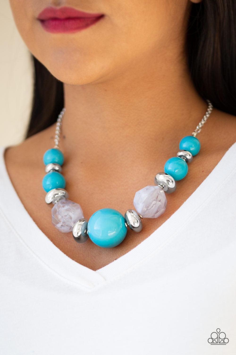 Paparazzi Accessories Daytime Drama - Blue Gradually increasing in size near the center, a collection of blue, silver, and cloudy beads join below the collar in a statement making fashion. Features an adjustable clasp closure. Jewelry