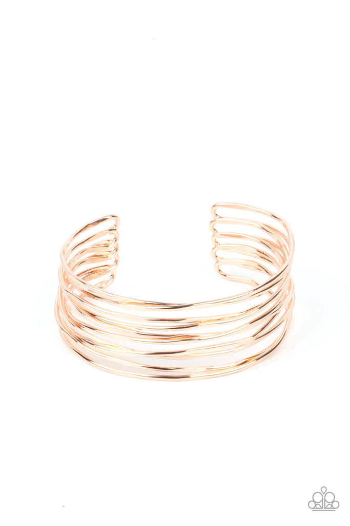 Paparazzi Accessories Nerves Of Steel - Rose Gold Featuring sections of flattened surfaces, glistening rose gold wires crisscross across the wrist, coalescing into an intense industrial cuff. Sold as one individual bracelet. Jewelry