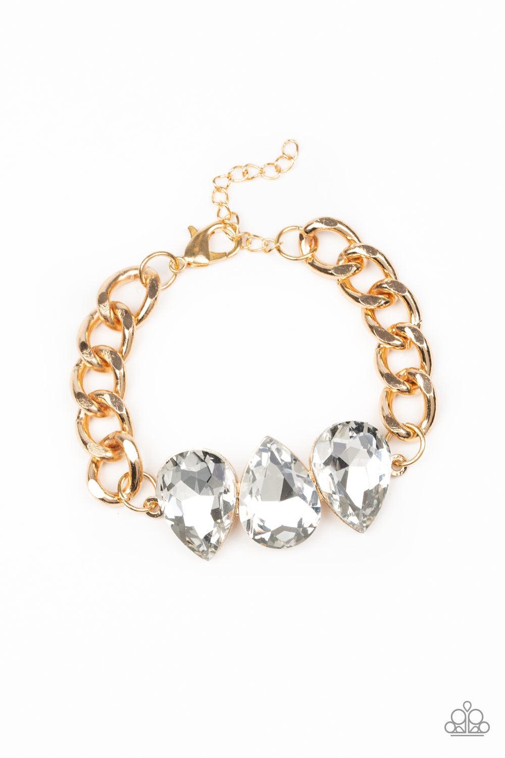 Paparazzi Accessories Bring Your Own Bling - Gold Three oversized white teardrop gems join at the center of a dramatic gold chain, creating a jaw-dropping display across the wrist. Features an adjustable clasp closure. Jewelry