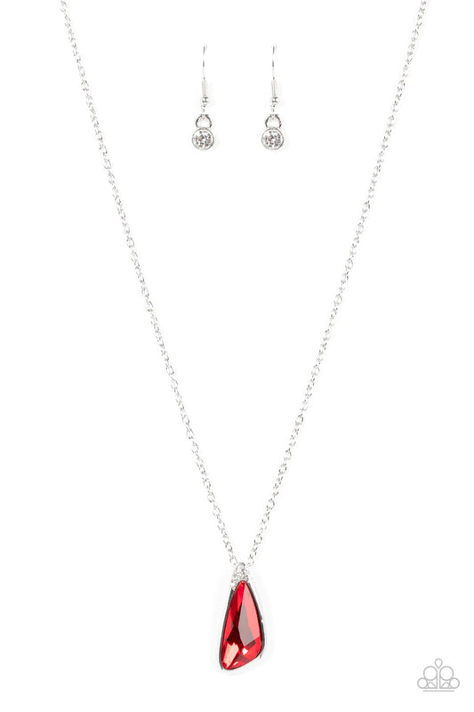 Paparazzi Accessories Envious Extravagance - Red An asymmetrical red gem is pressed into a shiny silver frame dusted in glassy white rhinestones, resulting in a refined pendant at the bottom of a dainty silver chain. Features an adjustable clasp closure.