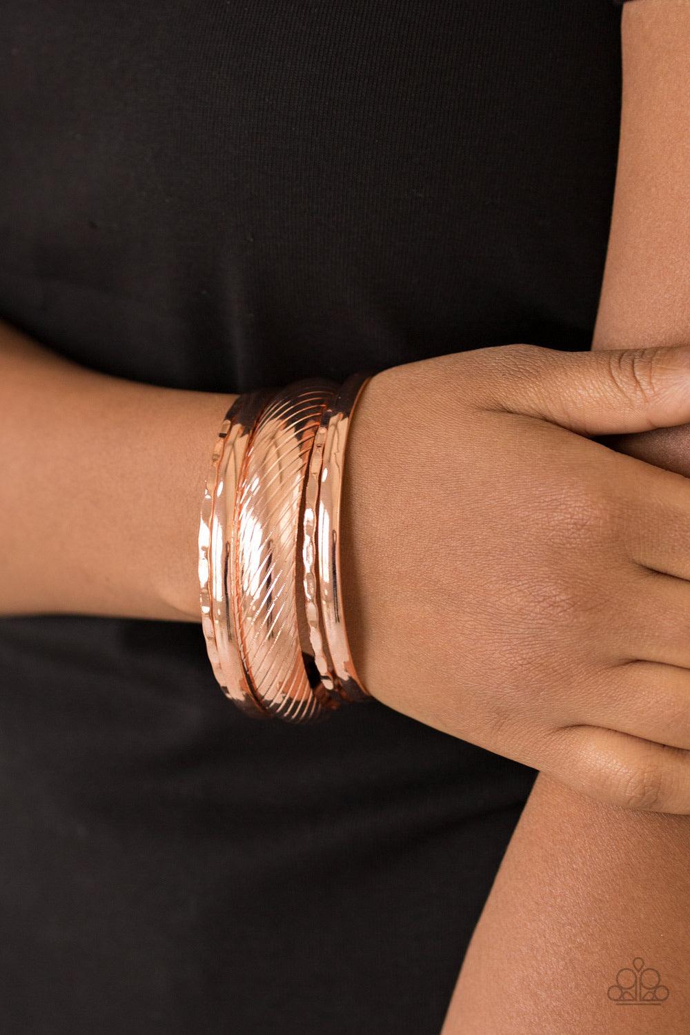 Paparazzi Accessories Boss of Boho - Copper Featuring serrated and smooth surfaces, mismatched shiny copper bangles stack across the wrist for a casual look. Jewelry