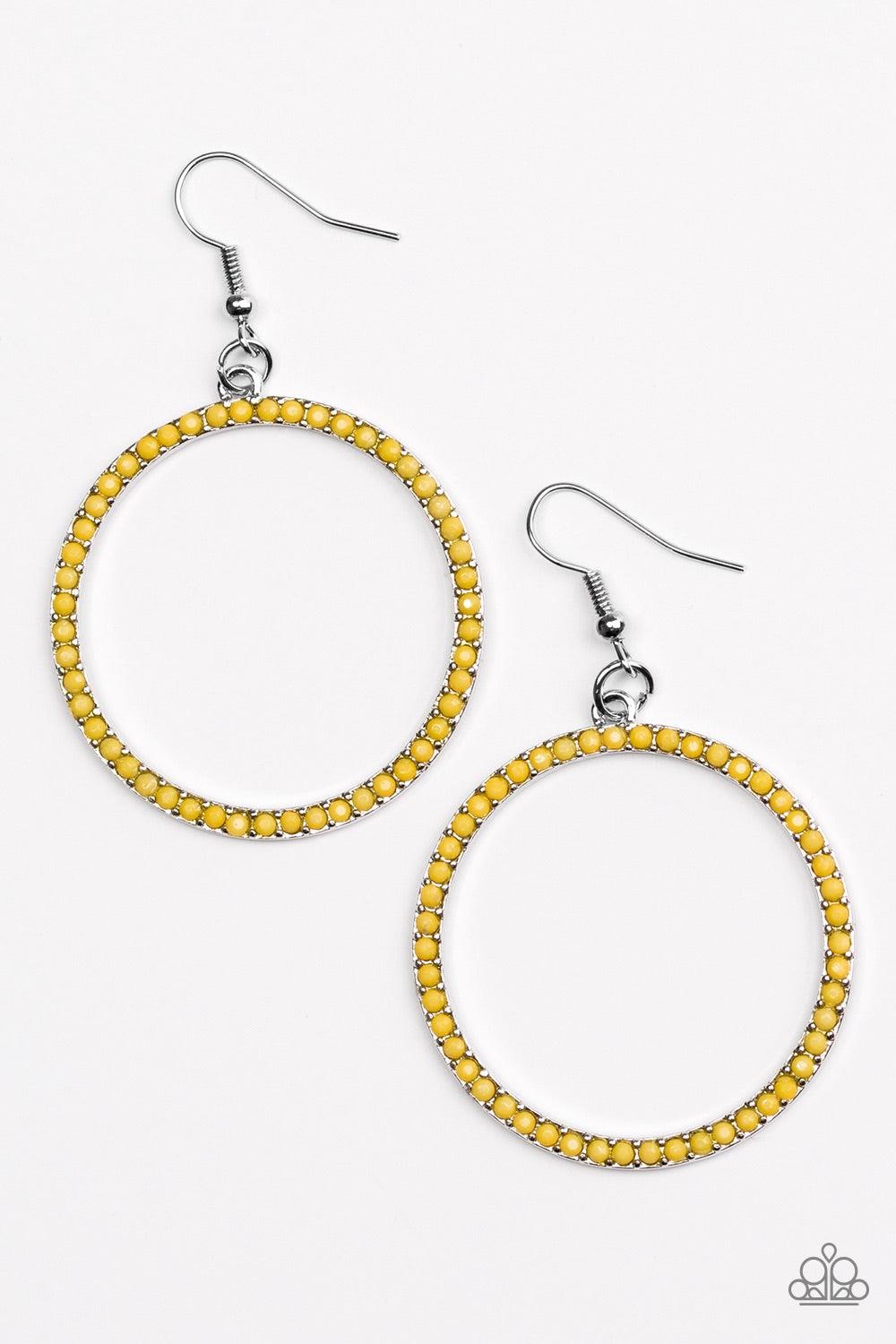 Paparazzi Accessories Spring Party - Yellow Dainty yellow beads are encrusted along a shimmery silver hoop for a perfect pop of seasonal color. Earring attaches to a standard fishhook fitting. Jewelry