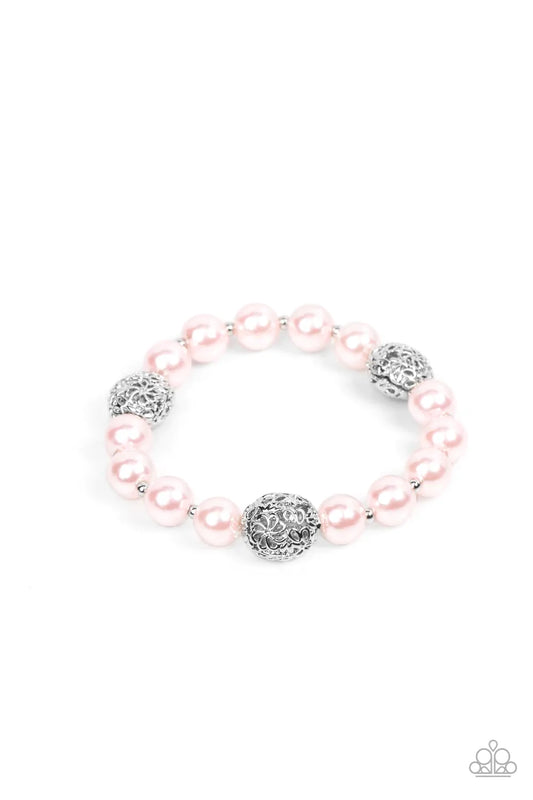 Paparazzi Accessories Upscale Whimsy - Pink Airy silver beads, featuring a floral filigree design, add a touch of whimsy to a strand of luminous pink pearl-like beads threaded along a stretchy band for a playfully upscale charm around the wrist. Sold as o
