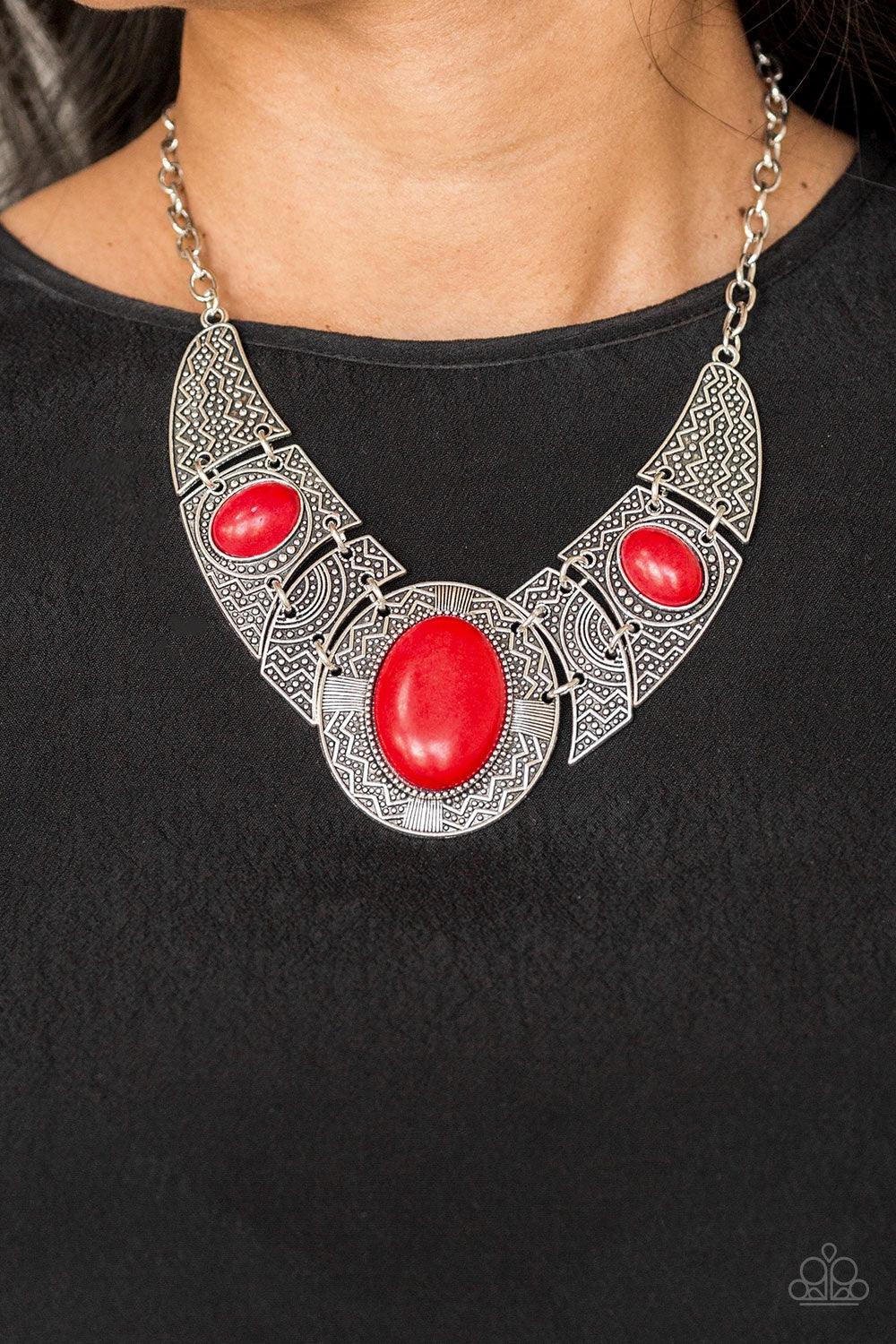 Paparazzi Accessories Leave Your LANDMARK - Red Radiating with studded and tribal inspired patterns, antiqued silver plates connect below the collar for a fierce look. Fiery red stones are pressed into the plates, adding an artisan flair to the dramatic c