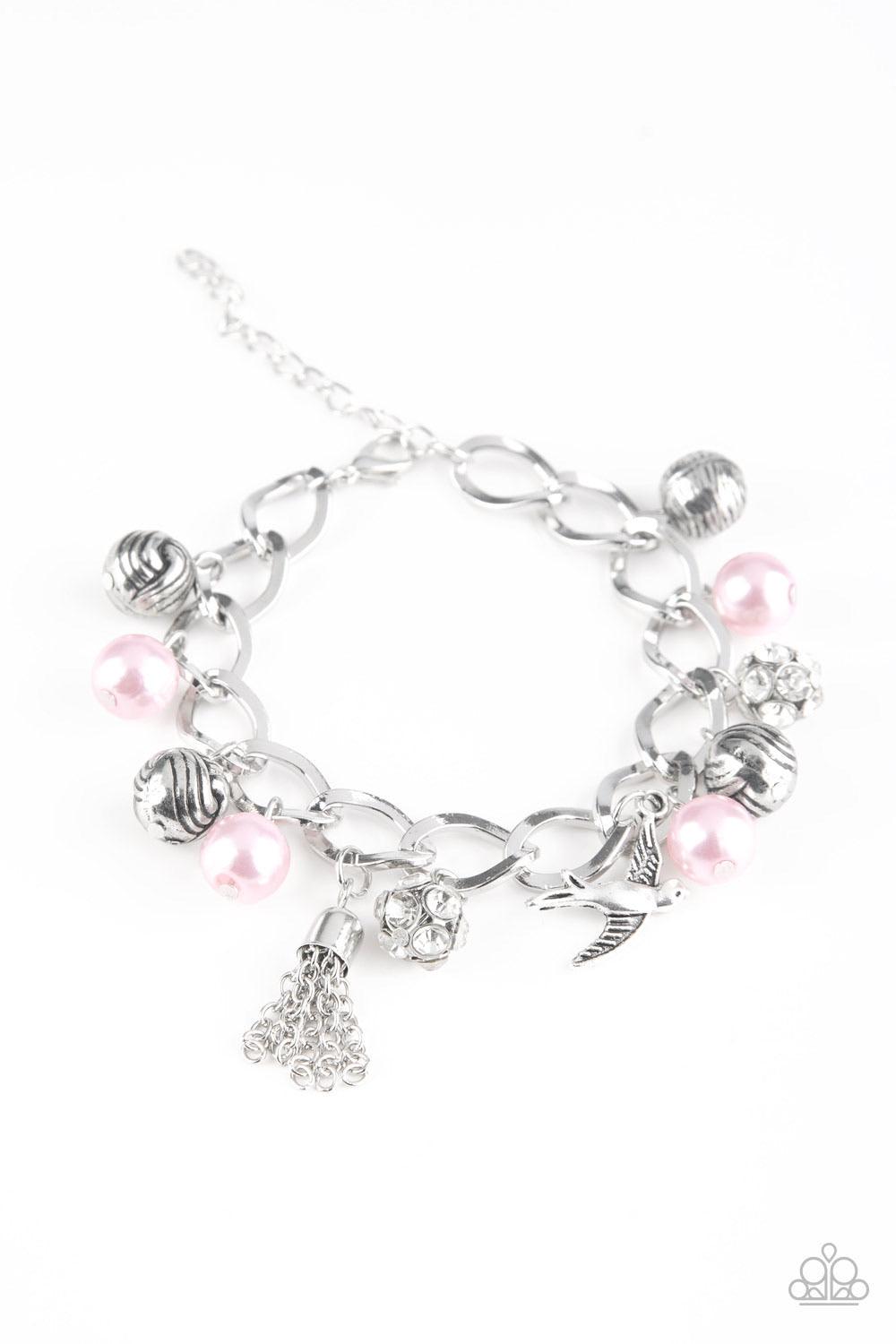 Paparazzi Accessories Lady Love Dove - Pink Pink pearls, ornate silver beads, and white rhinestone encrusted accents swing from a dramatic silver chain. A shimmery silver bird charm and silver tassel are added to the display, creating a whimsical fringe a