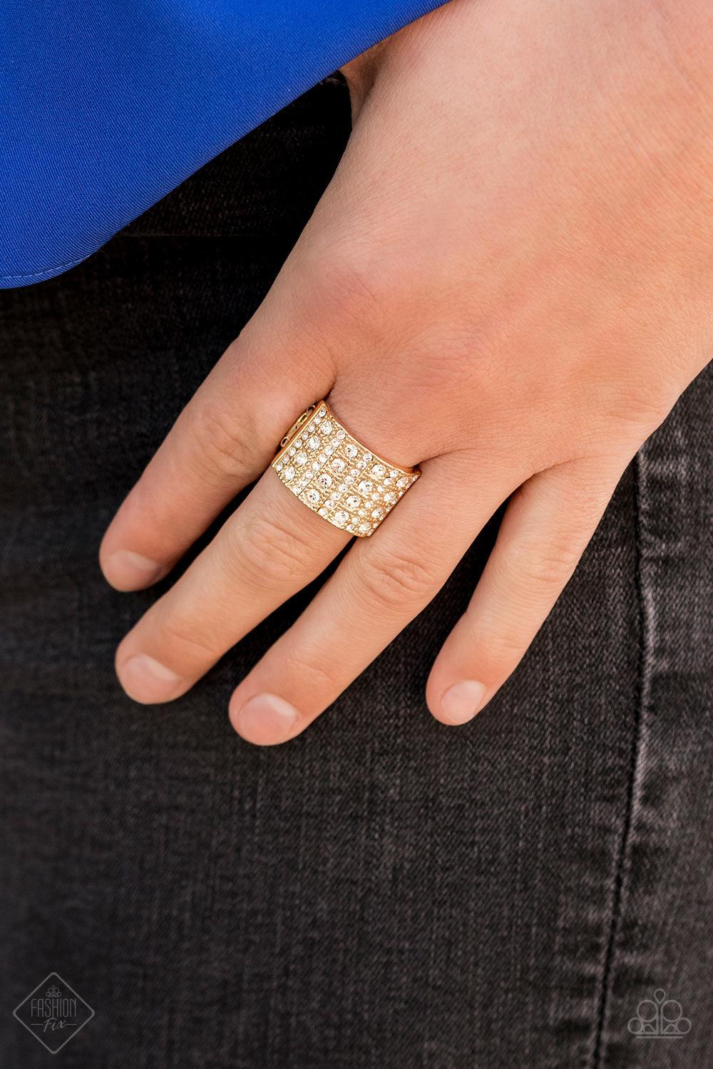 Paparazzi Accessories Diamond Drama - Gold Stacks of dainty and classic white rhinestones are vertically encrusted along a thick gold band, creating a blinding centerpiece. Features a stretchy band for a flexible fit. Jewelry