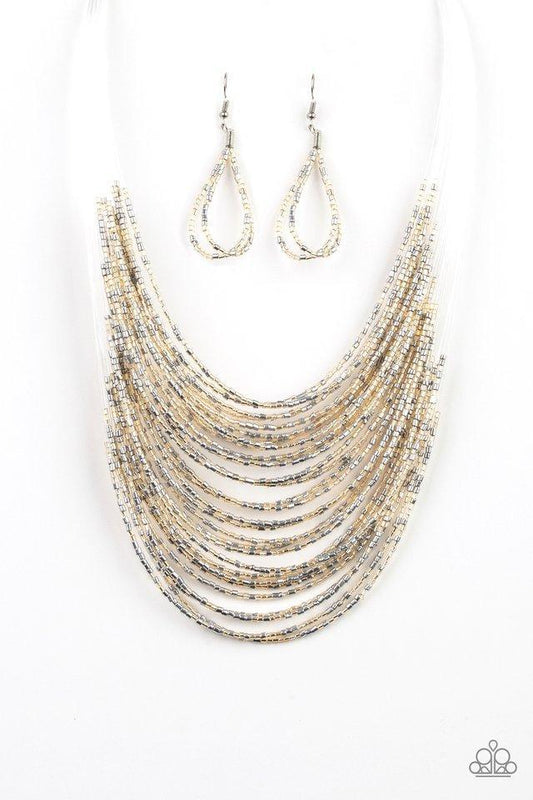 Paparazzi Accessories Catwalk Queen - Multi Strand after strand of metallic gold and silver seed beads fall together to create a bold statement piece. Features an adjustable clasp closure. Sold as one individual necklace. Includes one pair of matching ear